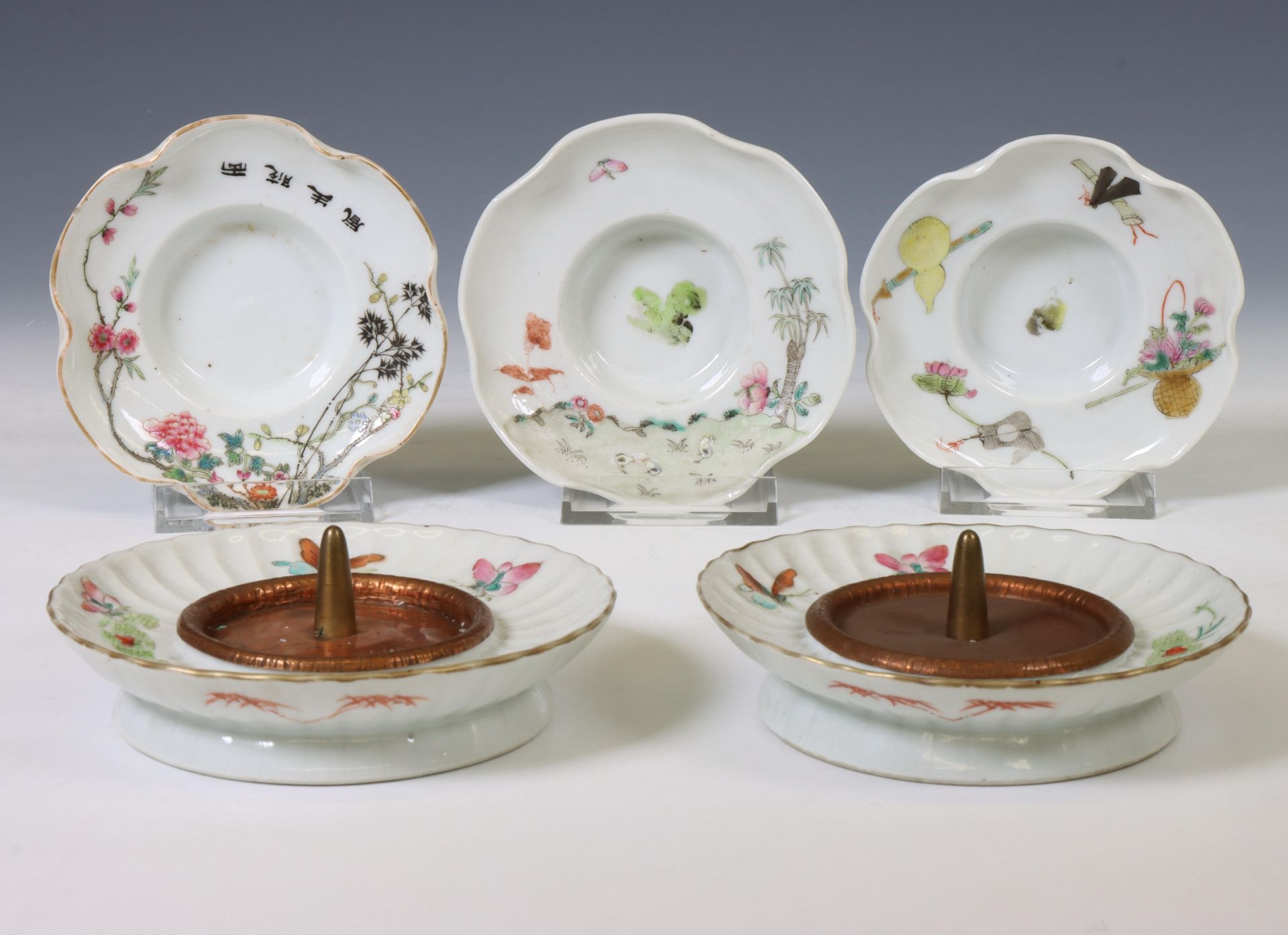 China, a collection of famille rose porcelain candleholders, 20th century,