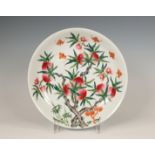 China, a famille rose 'nine peaches' plate, late 19th/ 20th century,
