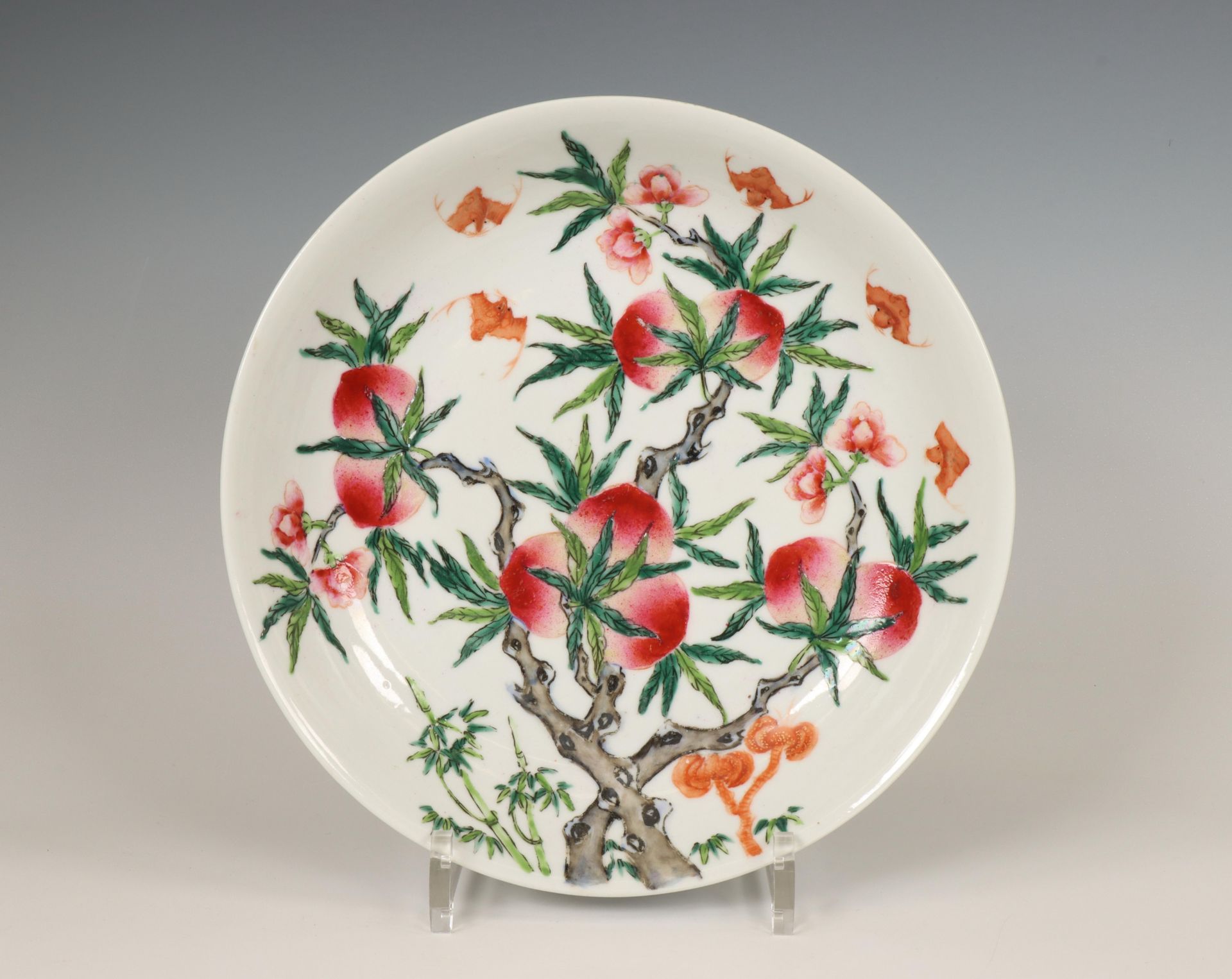 China, a famille rose 'nine peaches' plate, late 19th/ 20th century,