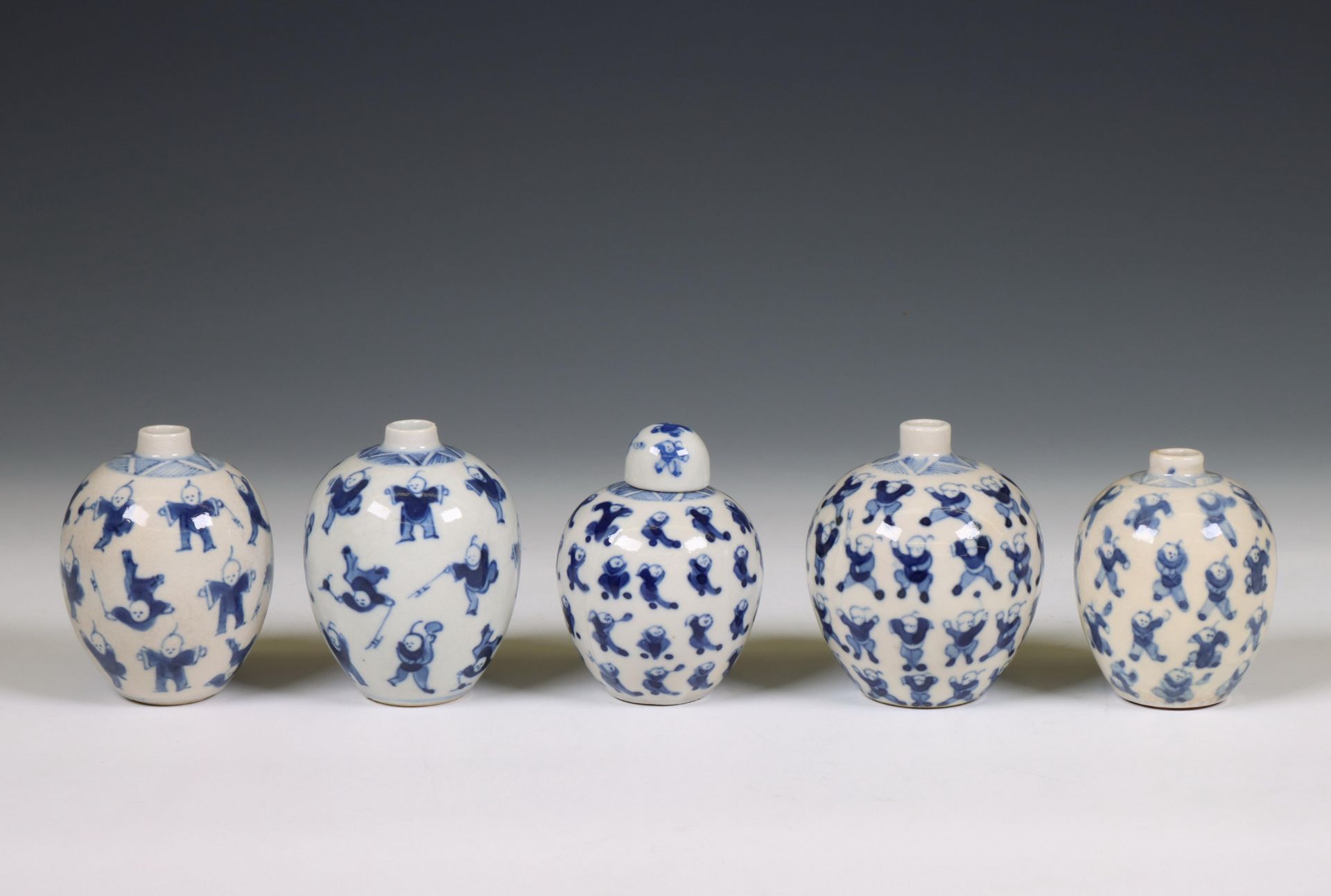 China, five soft paste blue and white 'one hundred boys' jarlets, 19th century,