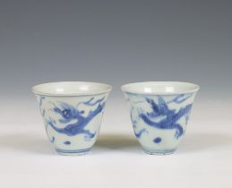 China, a pair of blue and white porcelain 'Hatcher Cargo' 'dragon' wine cups, circa 1640,