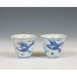 China, a pair of blue and white porcelain 'Hatcher Cargo' 'dragon' wine cups, circa 1640,