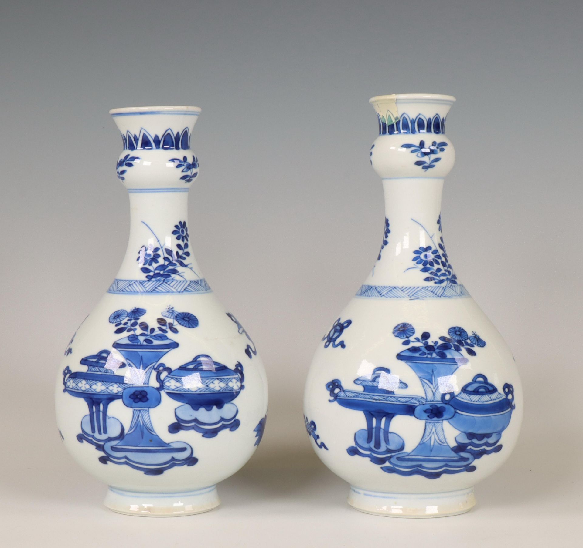 China, a pair of blue and white garlic-head vases, Kangxi period (1662-1722),