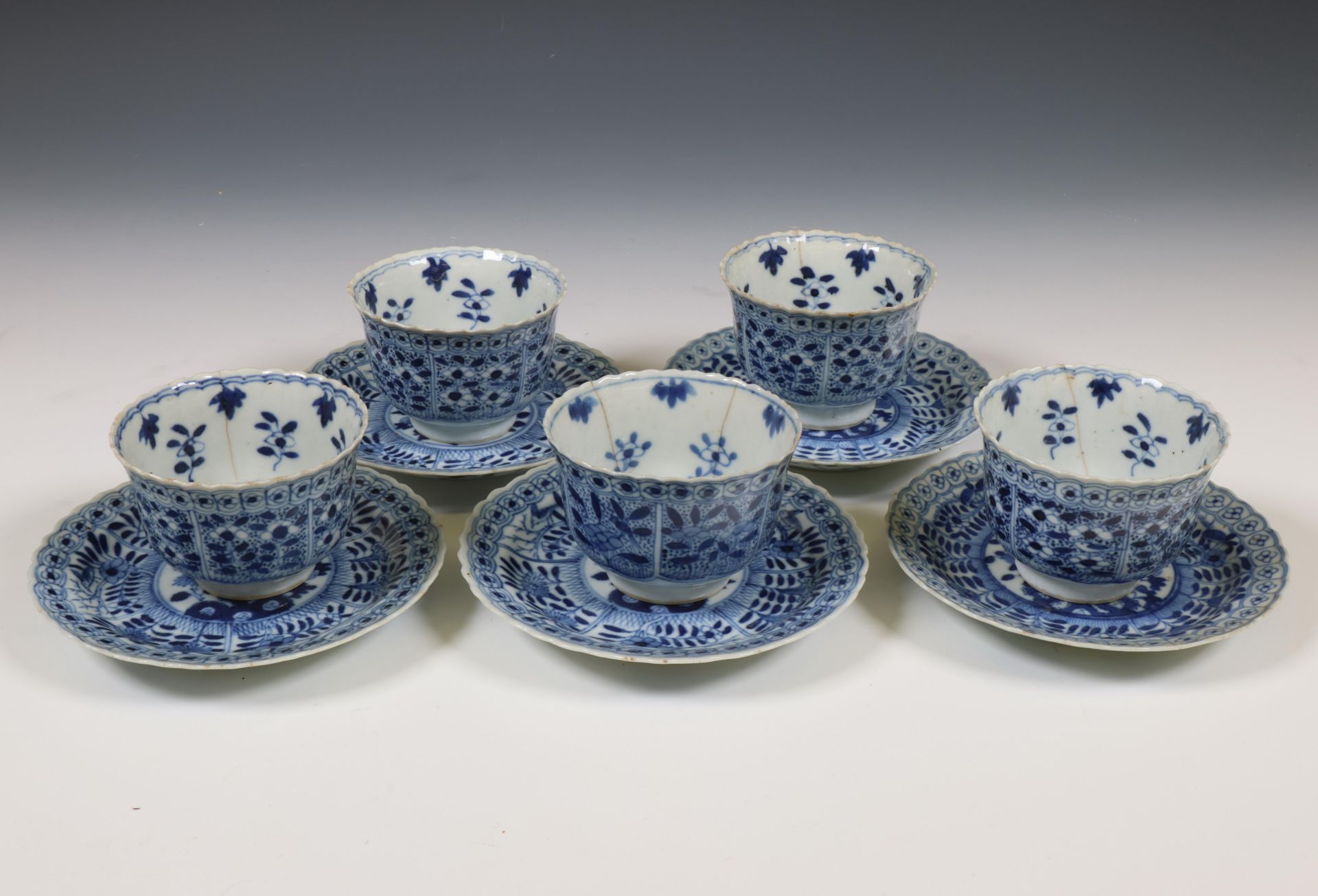 China, set of five blue and white porcelain cups and saucers, 18th/ 19th century,