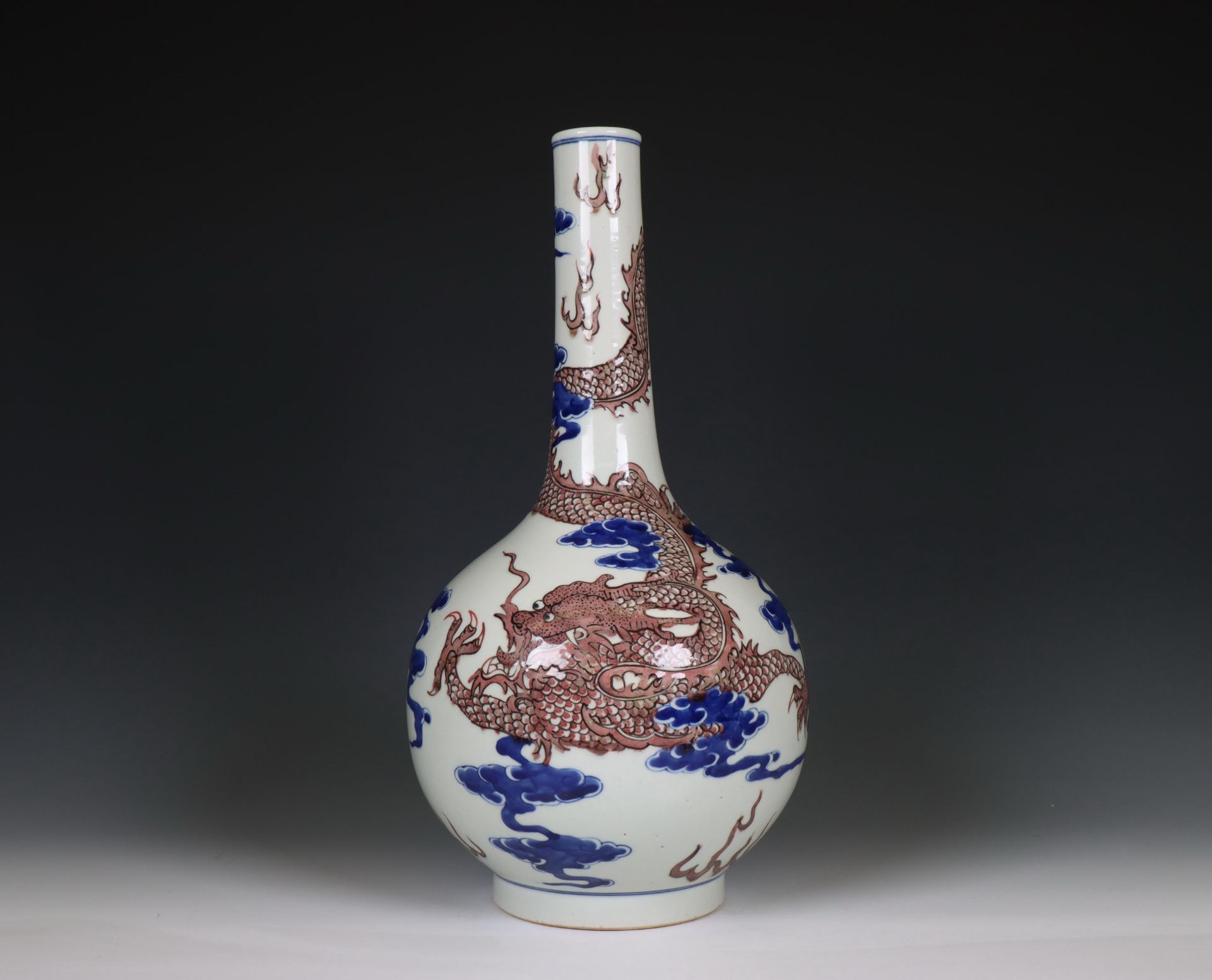 China, a blue and white and iron-red porcelain 'dragon' bottle vase, 20th century,