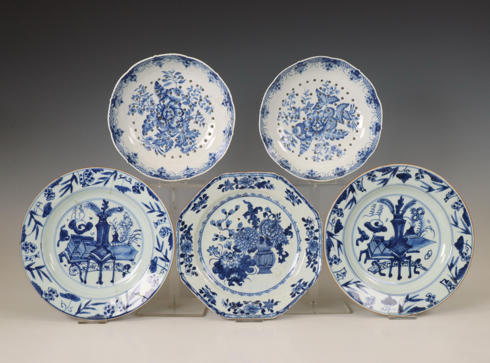 China, three blue and white plates and a pair of trivets, Qianlong period (1736-1795),