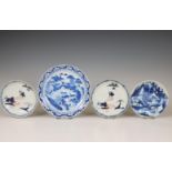 China, four blue and white 'landscape' saucers, 18th century and later,