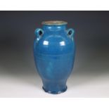 China, a blue-glazed earthenware lug-handled jar, ca. 1900,
