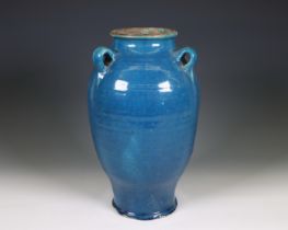 China, a blue-glazed earthenware lug-handled jar, ca. 1900,