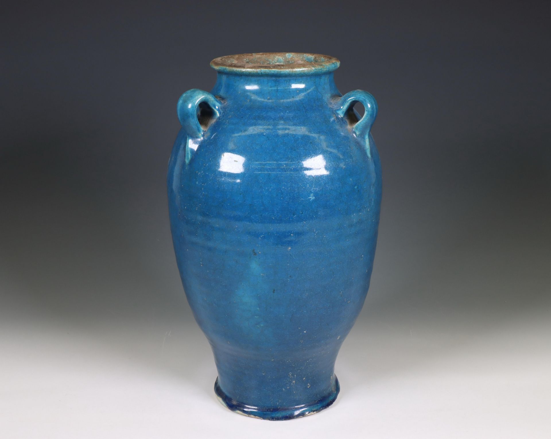 China, a blue-glazed earthenware lug-handled jar, ca. 1900,