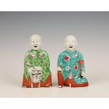 China, two famille rose models of the Hehe Erxian twins, late 19th century,