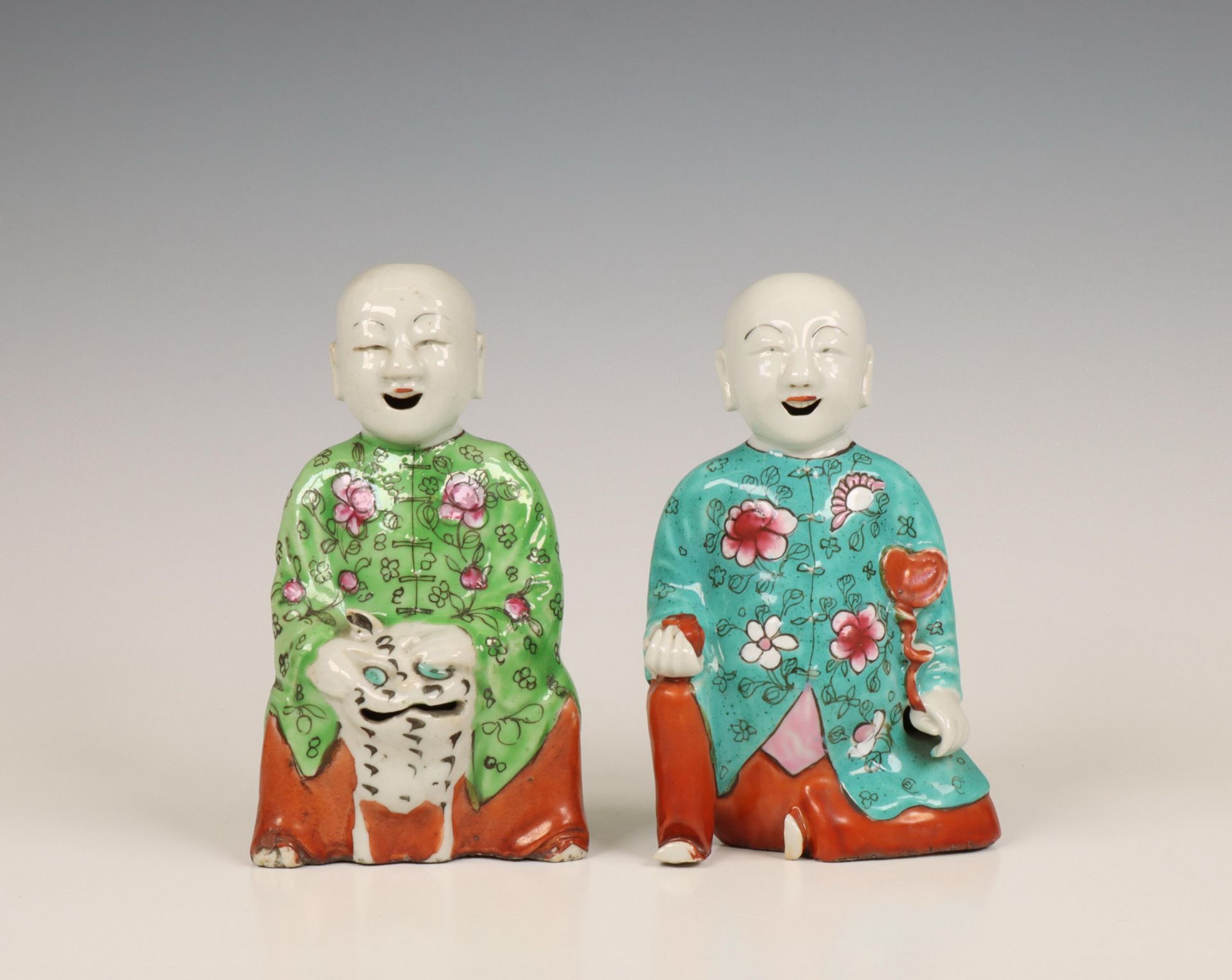 China, two famille rose models of the Hehe Erxian twins, late 19th century,