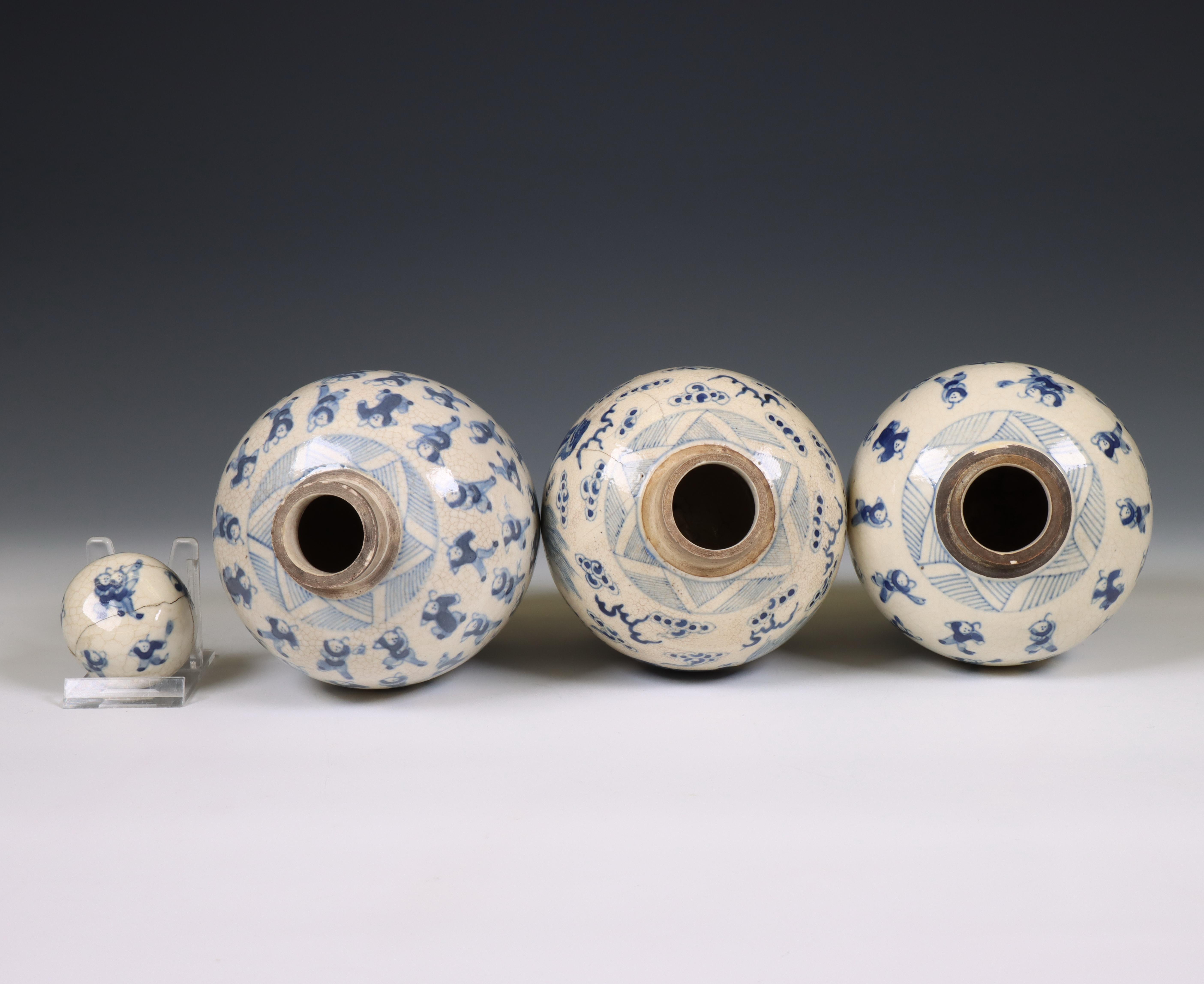 China, a pair of soft paste blue and white 'one hundred boys' jars and A 'buddhist lion' jar, 19th c - Image 2 of 4