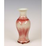 China, a streaked cream- and copper-red-glazed baluster vase, 19th/ 20th century,