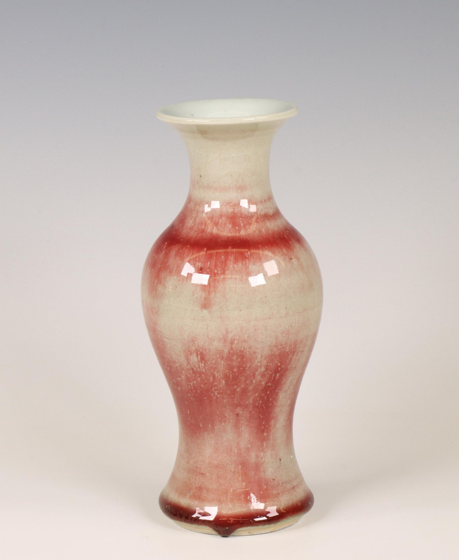 China, a streaked cream- and copper-red-glazed baluster vase, 19th/ 20th century,