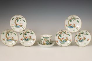 China, a set of seven famille verte auspicious 'deer and monkey' saucers with one cup, late 19th/ ea