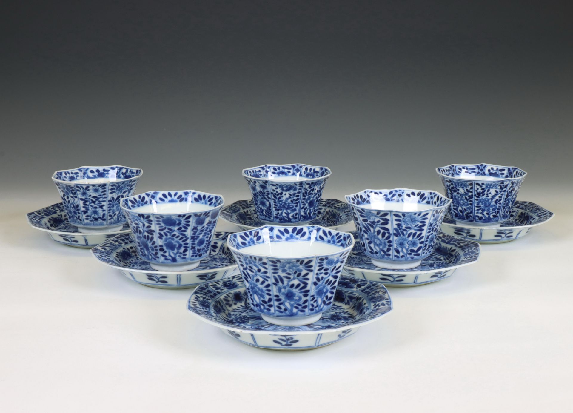 China, a set of seven blue and white porcelain cups and six saucers, Kangxi period (1662-1722),