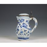 China, a blue and white porcelain gadrooned ewer and silver-mounted cover, Kangxi period (1662-1722)