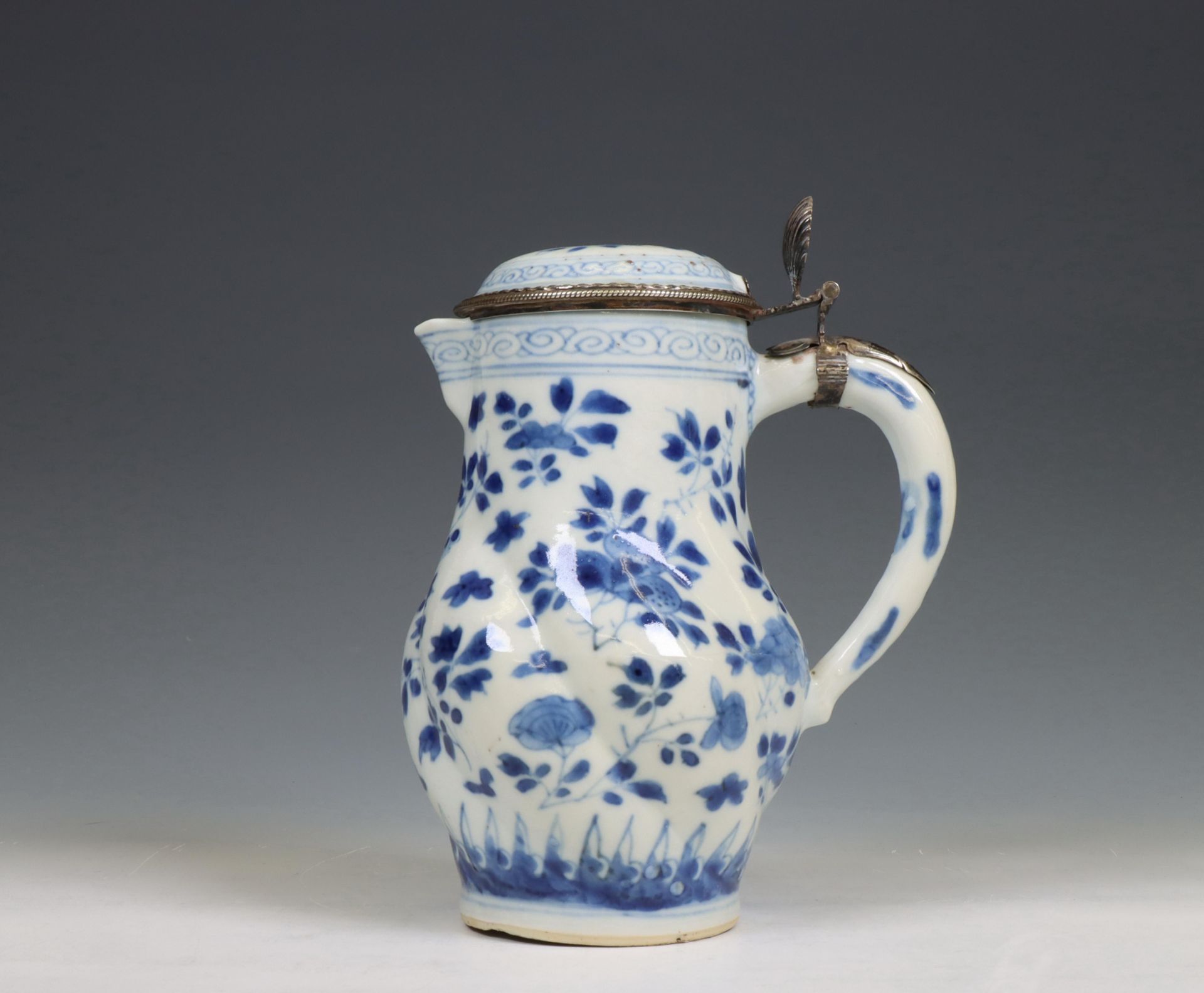 China, a blue and white porcelain gadrooned ewer and silver-mounted cover, Kangxi period (1662-1722)
