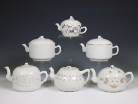 China, six various white-glazed and grisaille-decorated teapots and covers, 20th century,