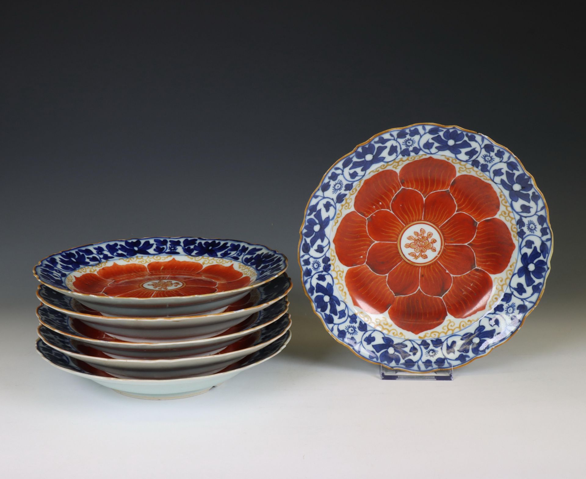 China, set of six blue and white and iron-red porcelain 'lotus' plates, late 18th/ 19th century,