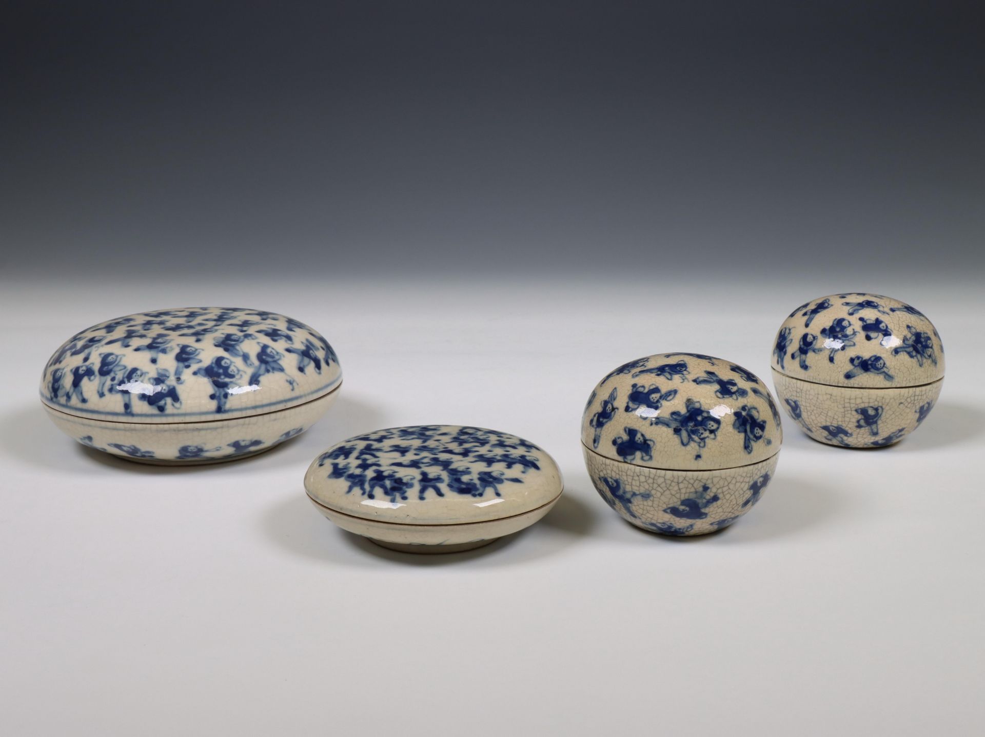 China, four soft paste blue and white 'one hundred boys' boxes, 19th century,