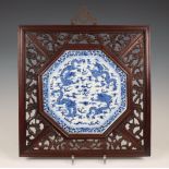China, a framed blue and white porcelain 'dragon' panel, late Qing dynasty (1644-1912),