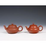 China, two Yixing earthenware teapots and covers,