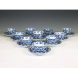 China, a set of ten blue and white porcelain cups and twelve saucers, Kangxi period (1662-1722),