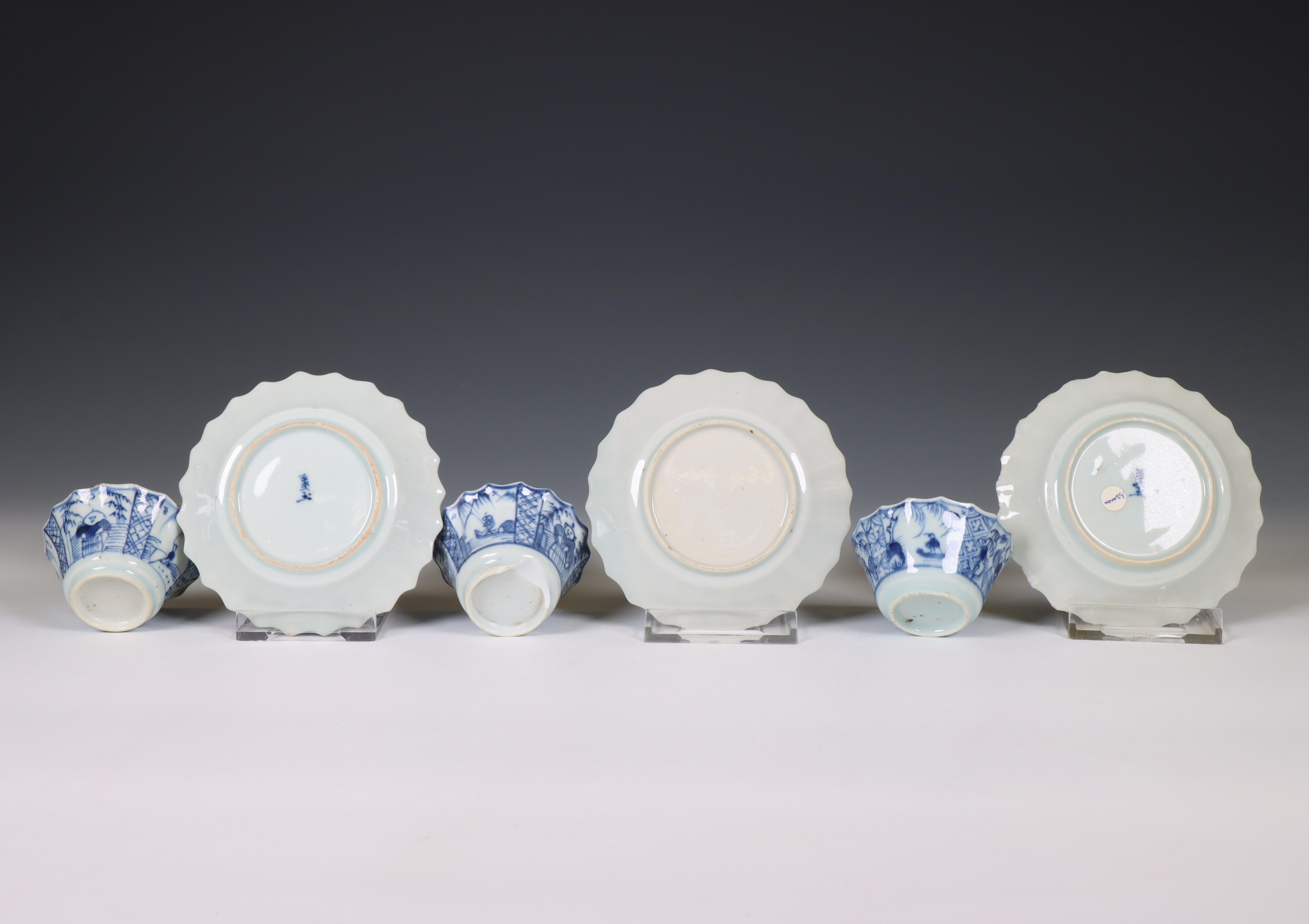 China, a set of three blue and white porcelain 'fisherman' cups and saucers, 18th century, - Image 2 of 3