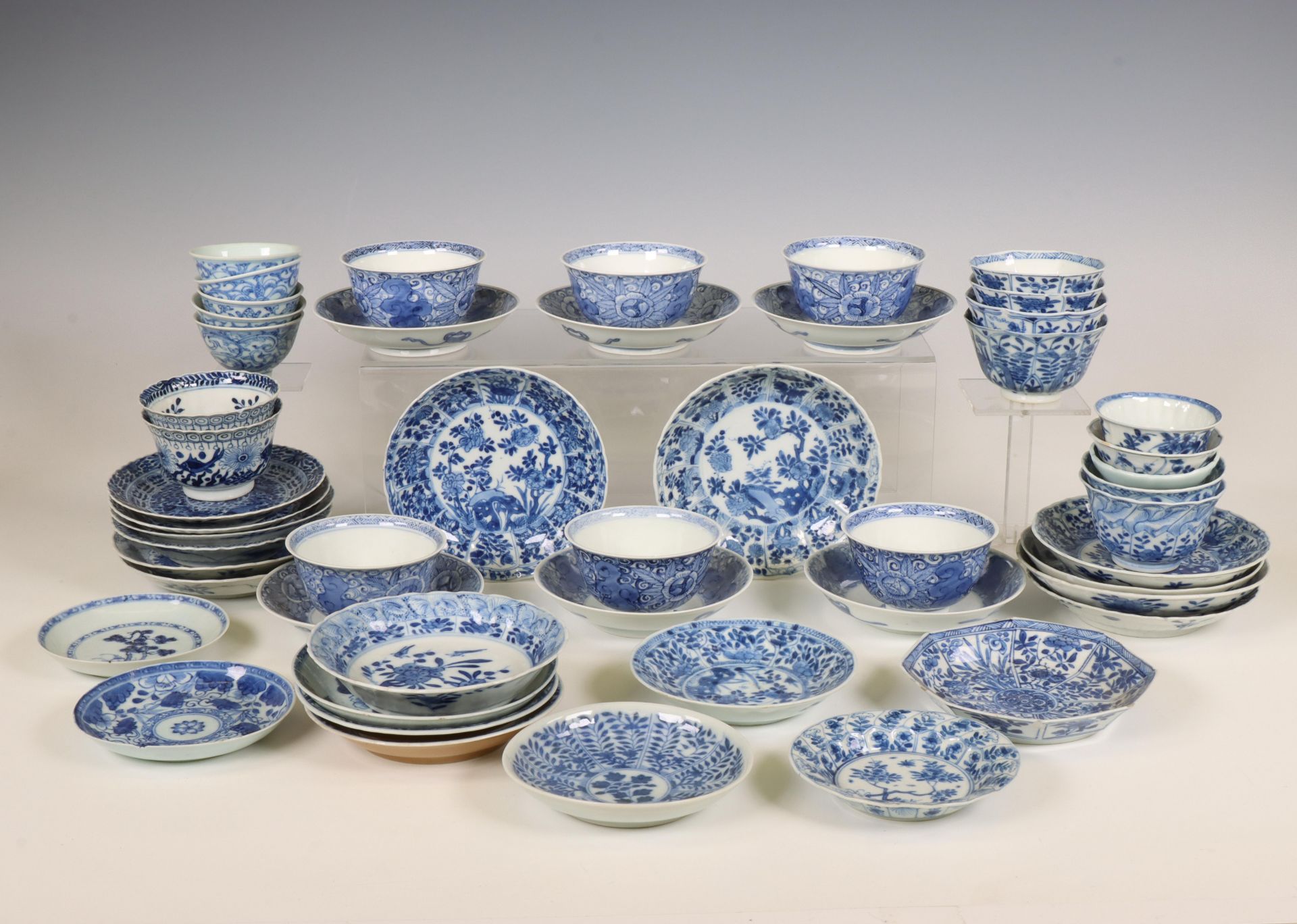 China, a large collection of blue and white porcelain cups and saucers, Kangxi period (1662-1722) an