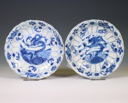 China, a near pair of blue and white 'dragon and carp' plates, Kangxi period (1662-1722),