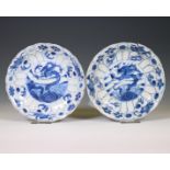 China, a near pair of blue and white 'dragon and carp' plates, Kangxi period (1662-1722),