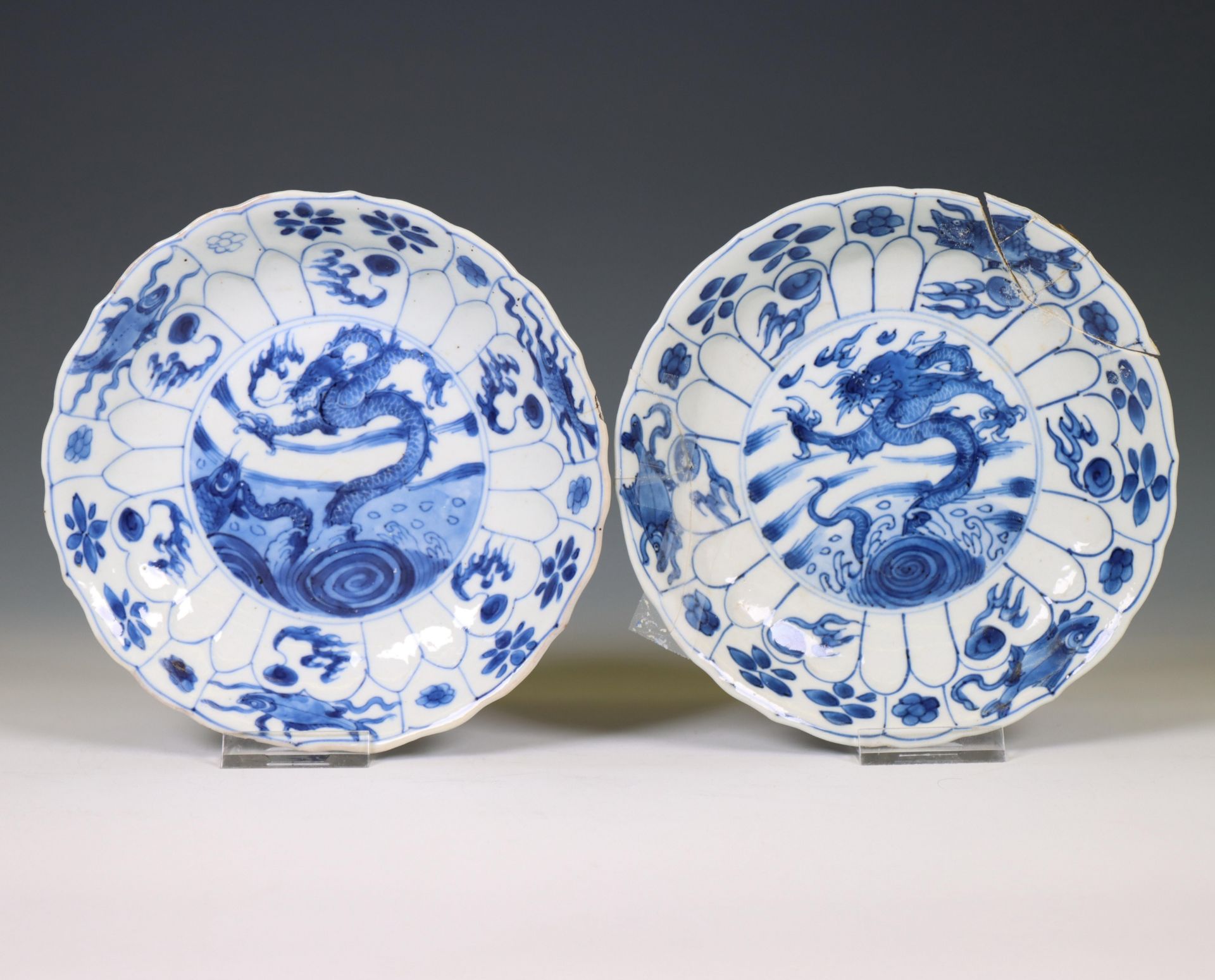 China, a near pair of blue and white 'dragon and carp' plates, Kangxi period (1662-1722),