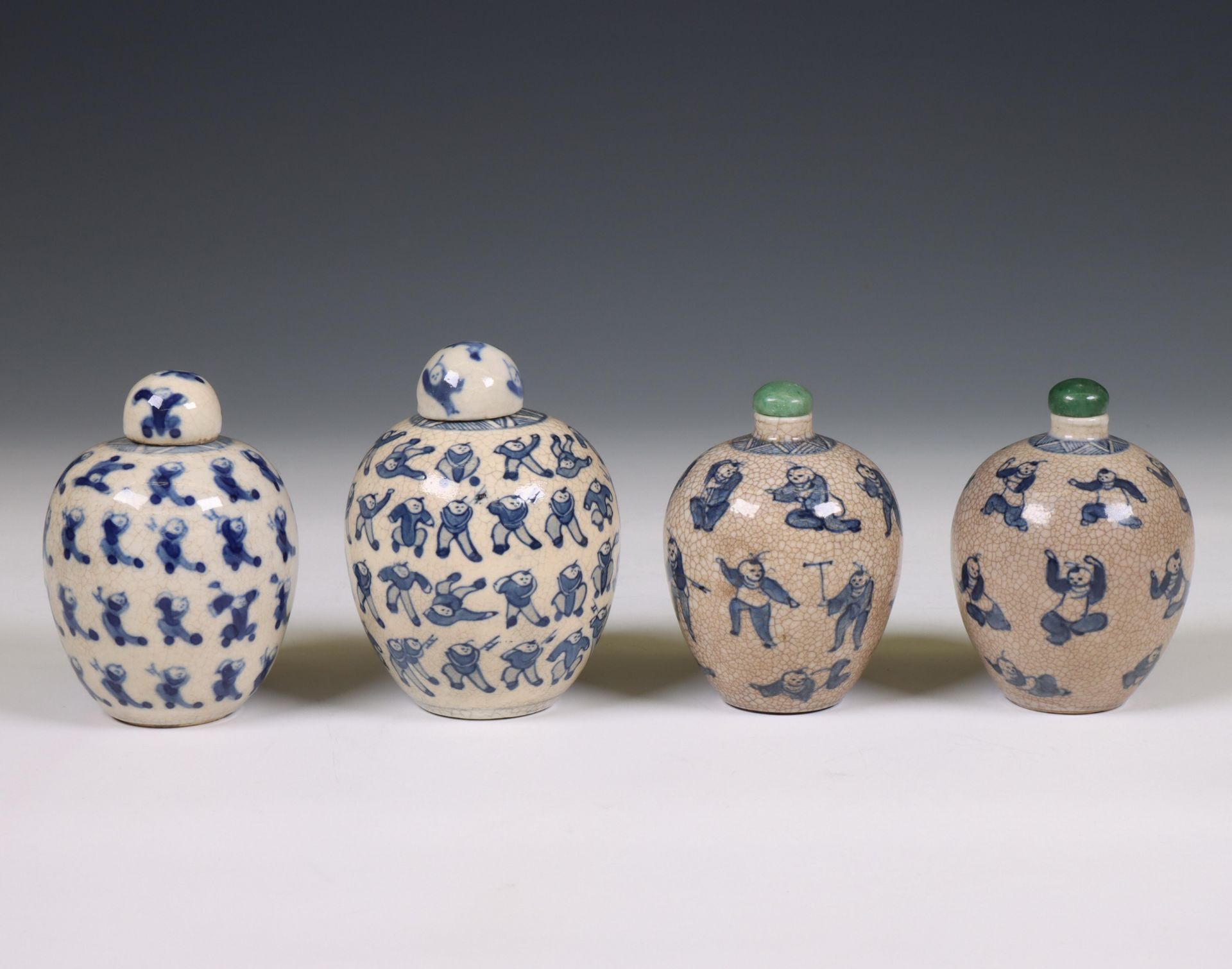 China, four soft paste blue and white 'one hundred boys' jarlets and covers, 19th century,