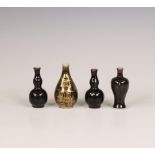 China, four black-glazed miniature vases,