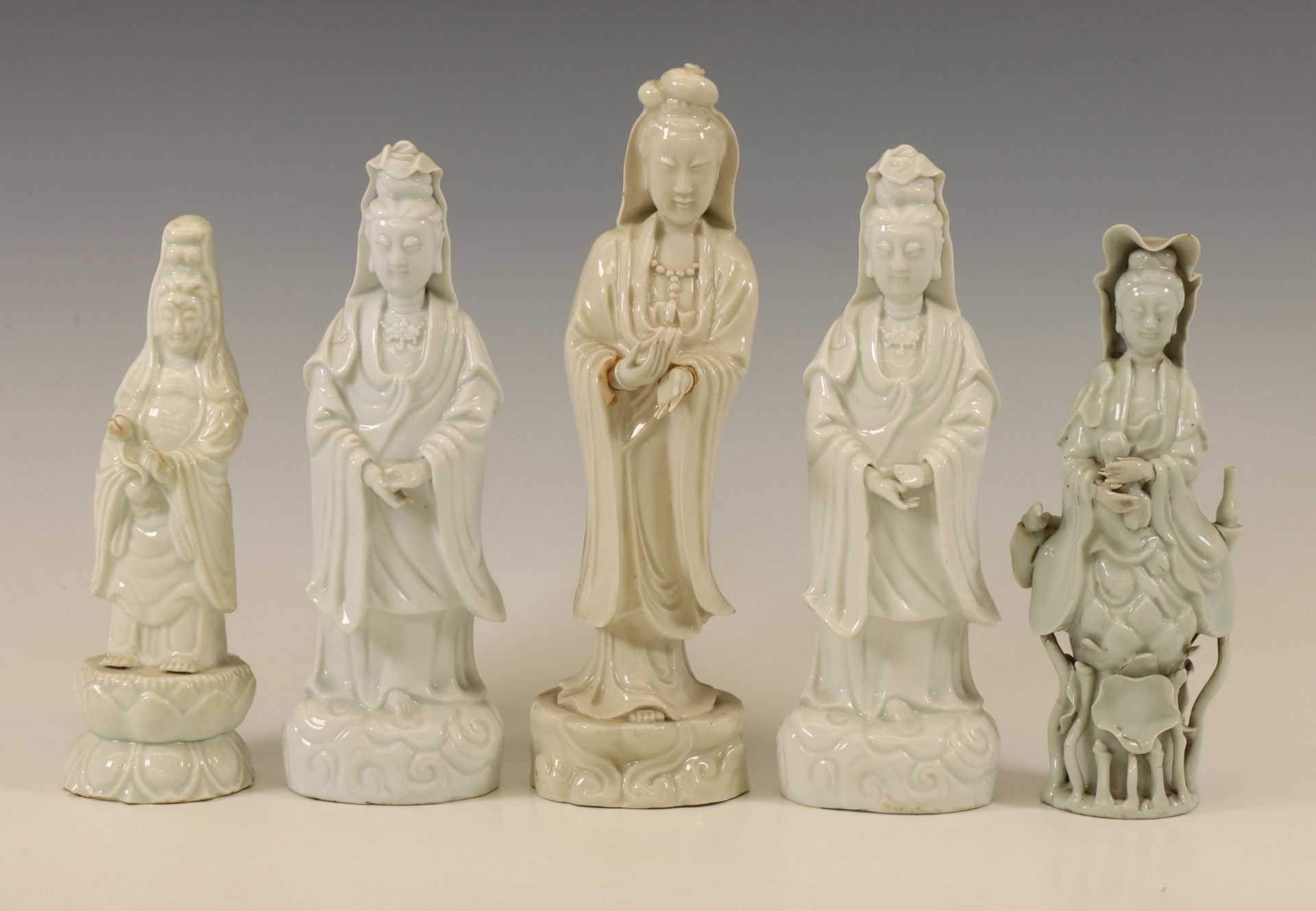 China, five various Dehua and white-glazed figures of Guanyin, modern,