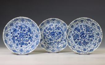 China, set of three blue and white porcelain 'lotus' dishes, Kangxi period (1662-1722),