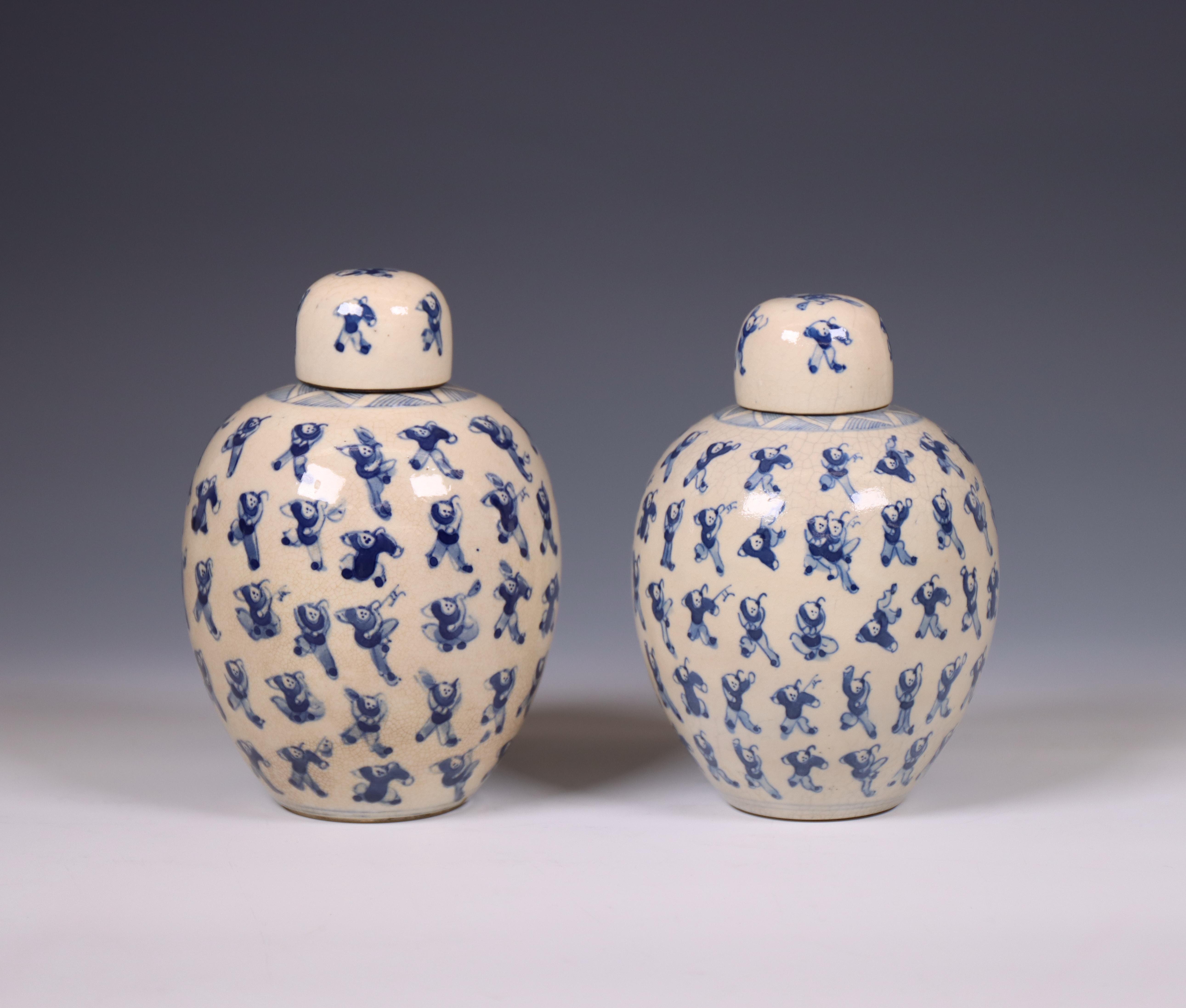 China, a pair of soft paste blue and white 'one hundred boys' jars and covers, 19th century,
