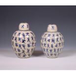 China, a pair of soft paste blue and white 'one hundred boys' jars and covers, 19th century,