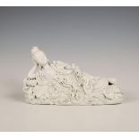 China, a Dehua porcelain reclining Guanyin, 20th century,