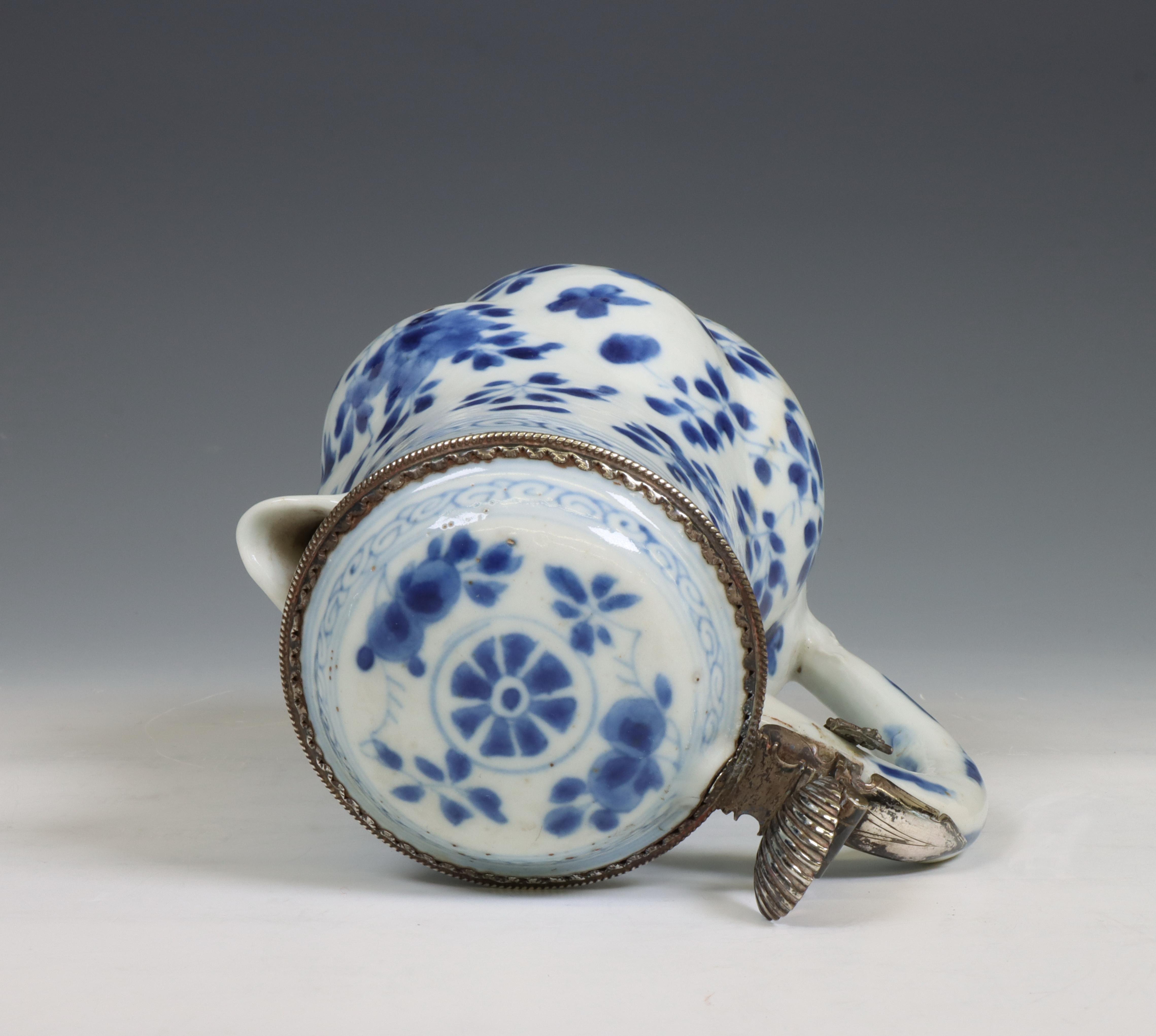 China, a blue and white porcelain gadrooned ewer and silver-mounted cover, Kangxi period (1662-1722) - Image 4 of 6
