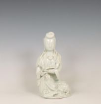 China, a white-glazed porcelain figure of Guanyin, ca. 1900,