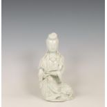 China, a white-glazed porcelain figure of Guanyin, ca. 1900,