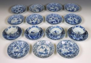 China, a set of four blue and white porcelain cups and fifteen saucers, Kangxi period (1662-1722),