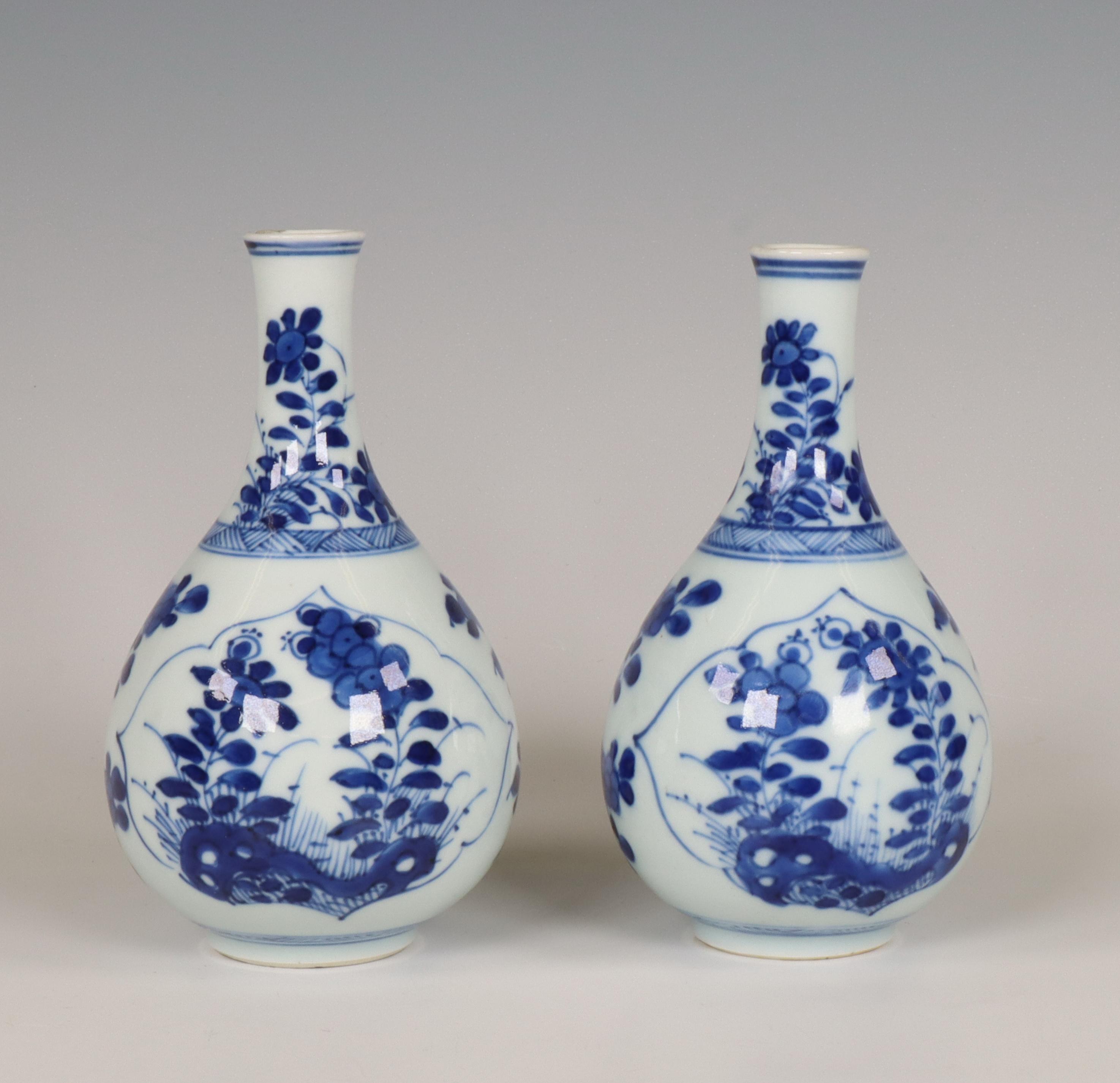 China, a pair of small blue and white porcelain bottle vases, Kangxi period (1662-1722), - Image 2 of 7