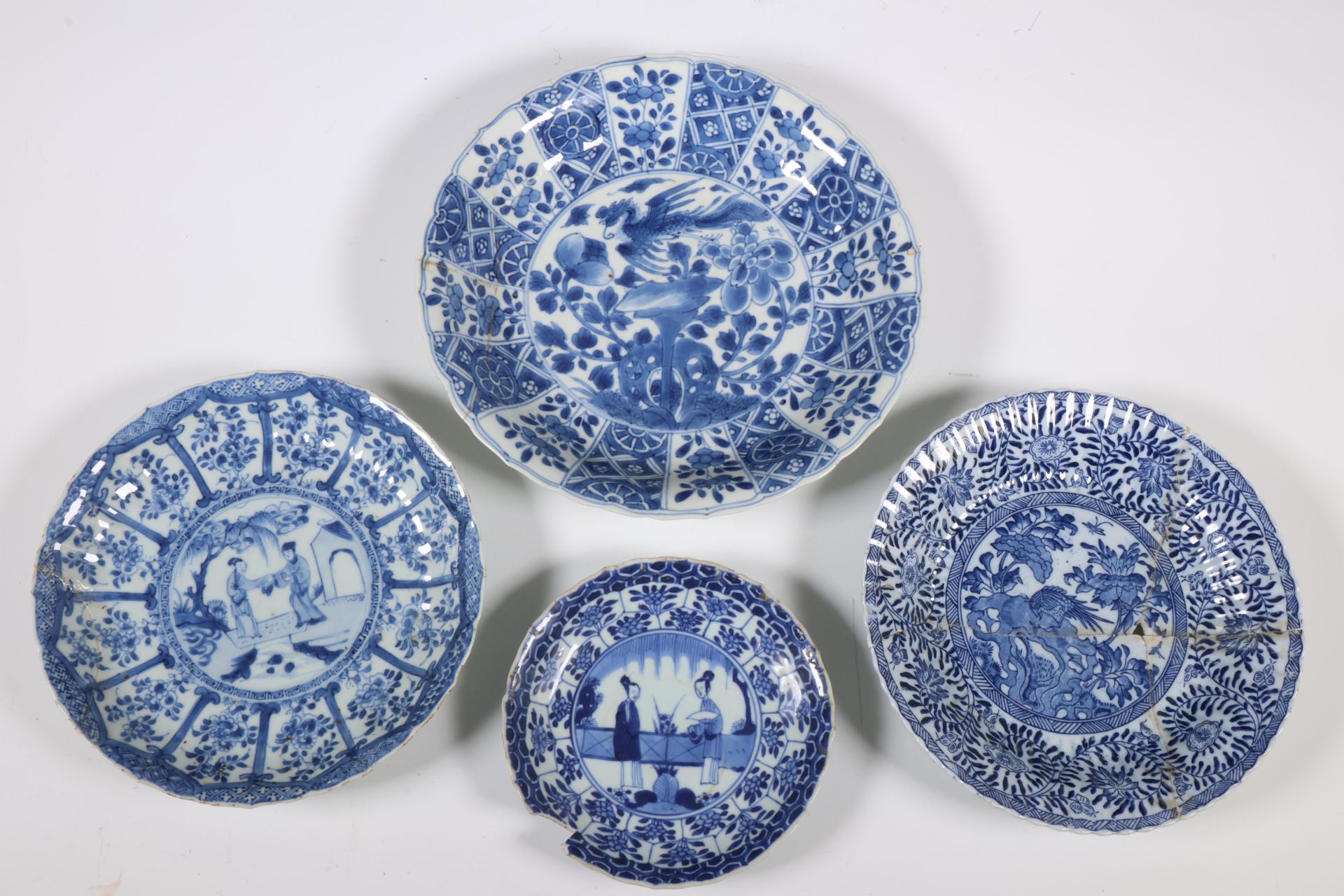 China, four various blue and white porcelain plates, Kangxi period (1662-1722) and later,