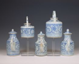 China, a collection of five blue and white porcelain teapots and milk-jugs and covers, 20th century,