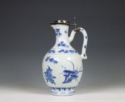 China, a Transitional silver-mounted blue and white porcelain ewer, mid 17th century, the silver lat