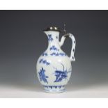 China, a Transitional silver-mounted blue and white porcelain ewer, mid 17th century, the silver lat